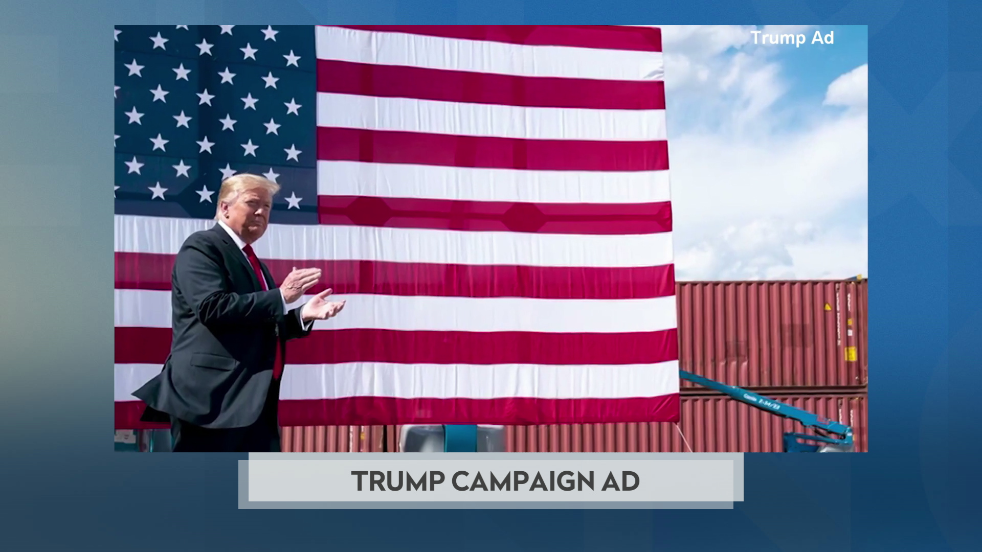 A still image from a political television commercial shows Donald Trump standing in front of a U.S. flag with shipping containers in the background, with a graphic at bottom reading "Trump Campaign Ad."