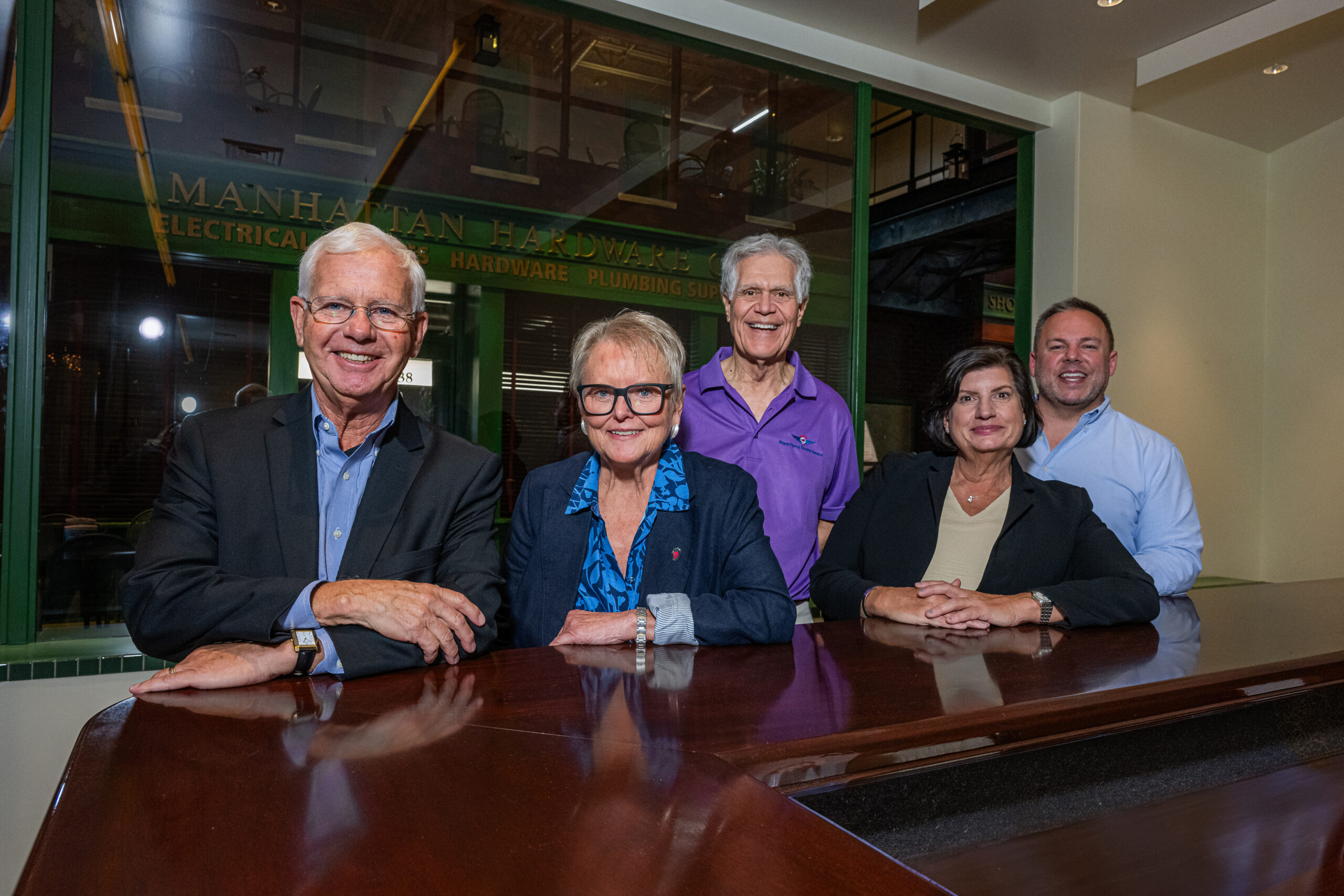 Five members of the Friends of PBS Wisconsin board pose for a photo after a meeting.