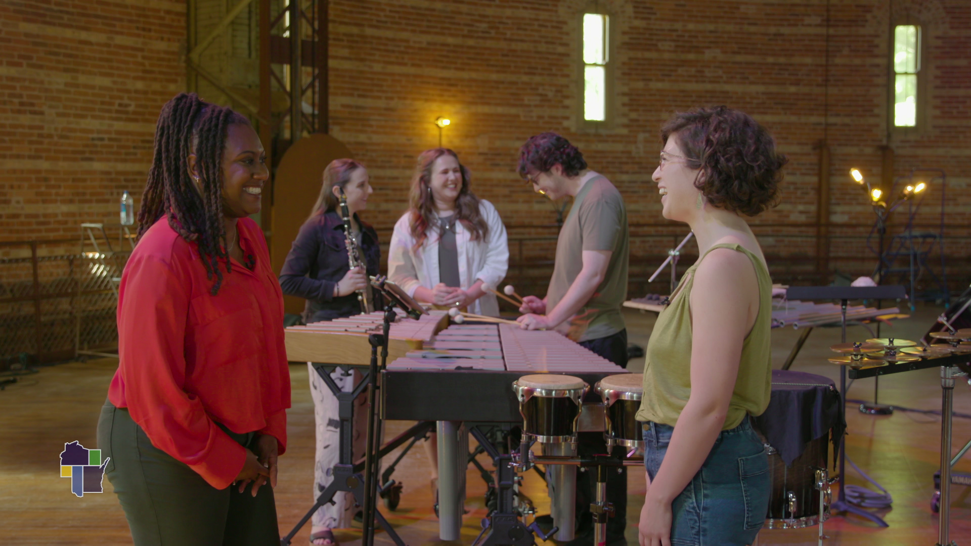 Wisconsin Life host Angela Fitzgerald on the left interviews a composer and musicians at Yerkes Observatory in Williams Bay.