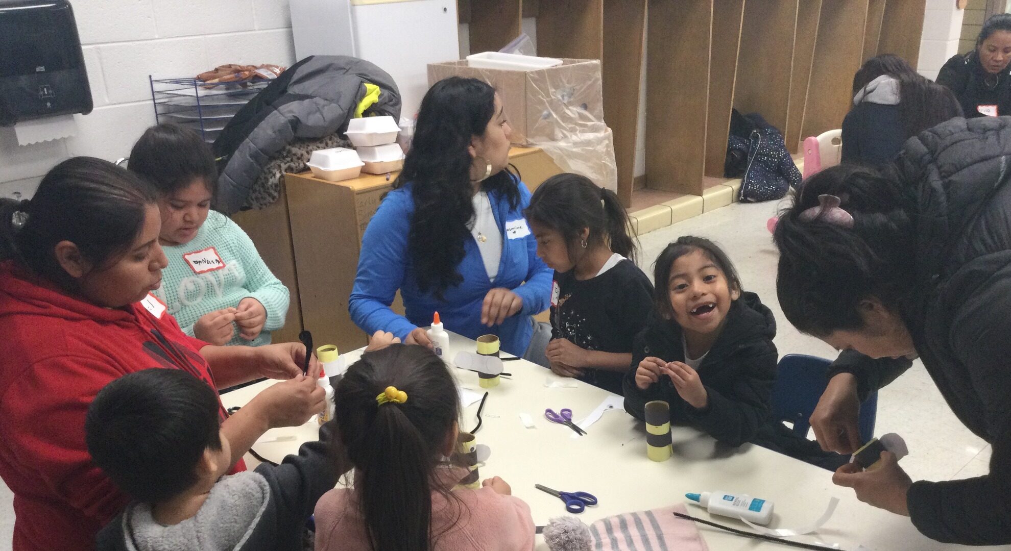 Families doing an activity at a table