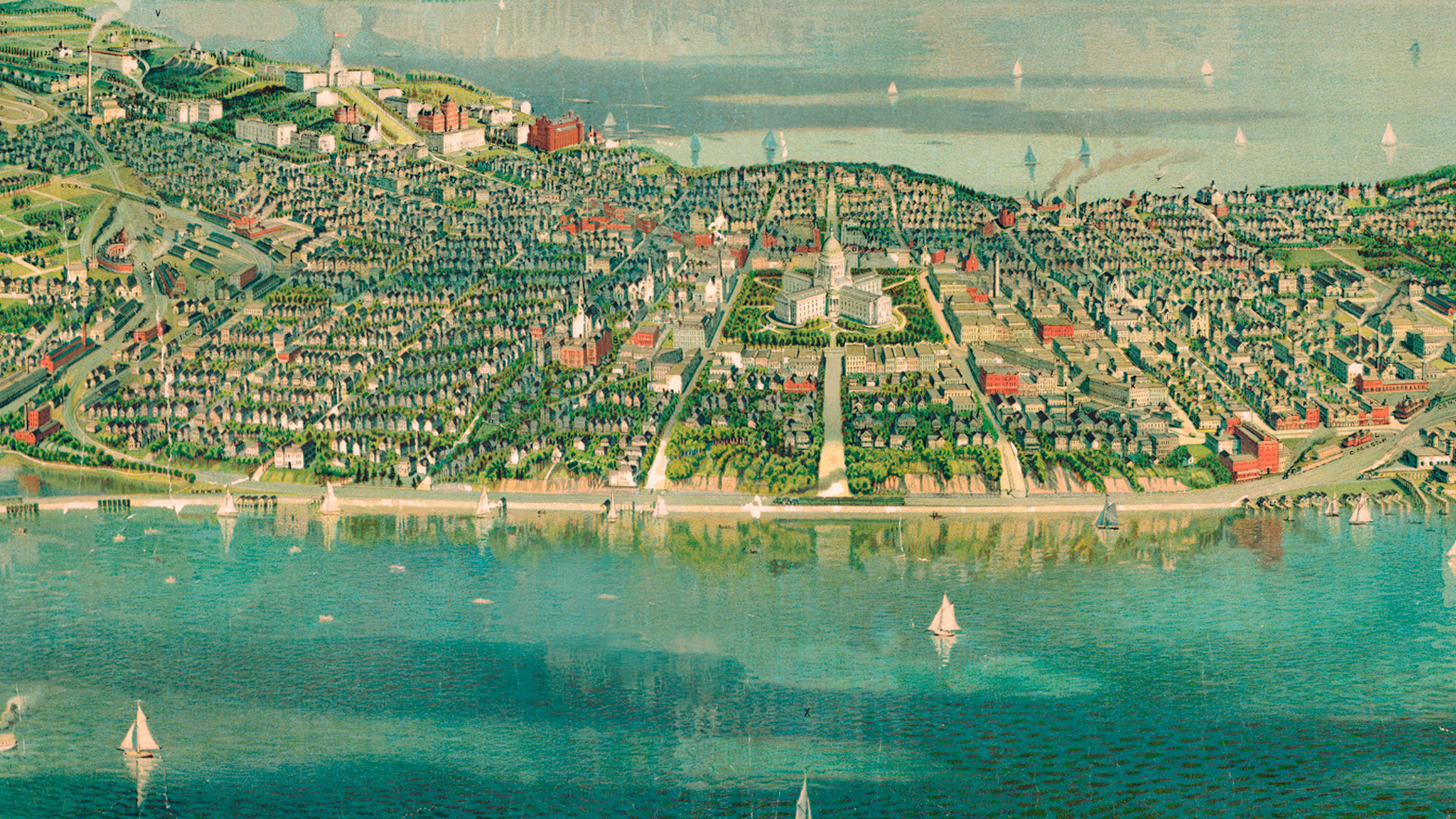 A vintage illustrated map depicts a cityscape with a domed capitol building at its center, surrounded by dense neighborhoods, roads, and waterfront areas with sailboats on the water.