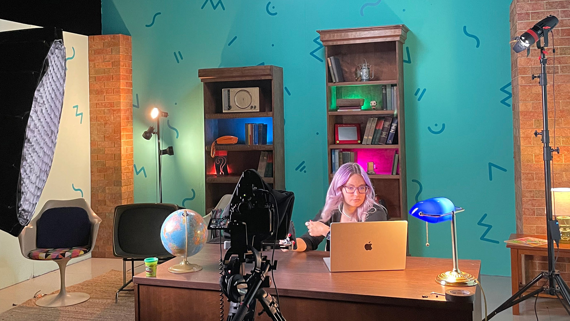 Kacie Lucchini Butcher, public historian and The Look Back co-host, sits for a recording session in the PBS Wisconsin studios. (Source: The Look Back | PBS Wisconsin.)