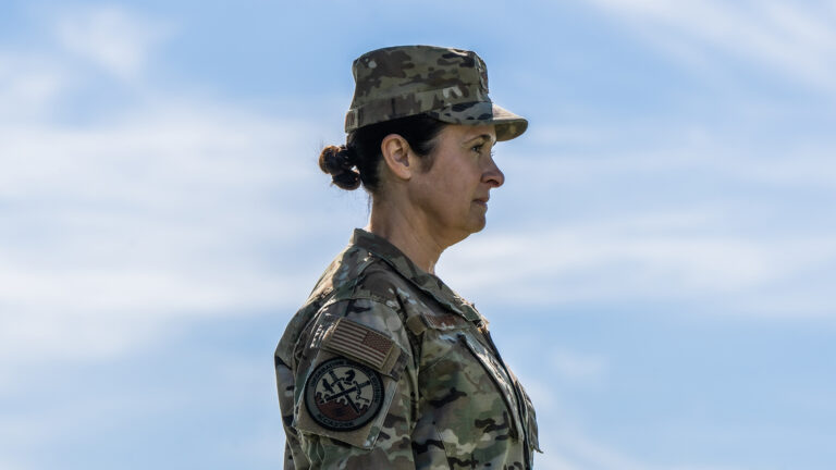 Leslie Zyzda Martin poses for a portrait while wearing a combat uniform.