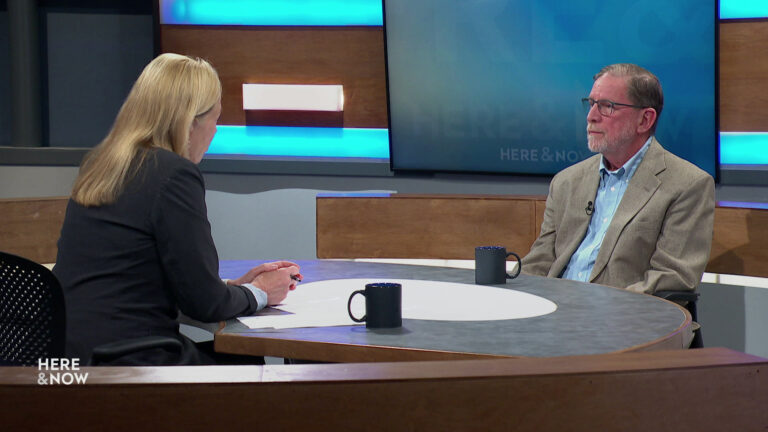 Frederica Freyberg and Dr. Michael Siebers sit facing each other on the Here & Now set.