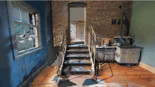 Historic keeper’s quarters with phonograph, wooden chairs, rug and victrola