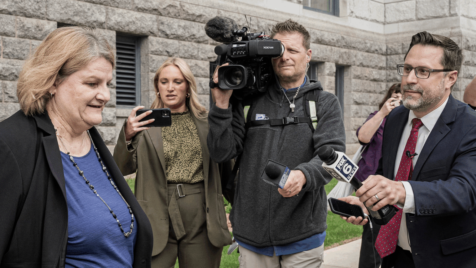 Milwaukee County Circuit Judge Hannah Dugan Milwaukee County Circuit Judge Hannah Dugan walks outside a stone building while surrounded by reporters. A cameraman films, a woman holds up a phone, and a man in a suit and glasses extends a microphone labeled “Fox 6.” Milwaukee County Circuit Judge Hannah Dugan Milwaukee County Circuit Judge Hannah Dugan walks outside a stone building while surrounded by reporters. A cameraman films, a woman holds up a phone, and a man in a suit and glasses extends a microphone labeled “Fox 6.”