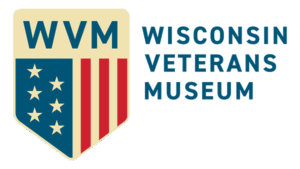 Wisconsin Veterans Museum Wisconsin Veterans Museum logo with shield showing “WVM,” stars, and red stripes next to the museum name in bold blue text.
