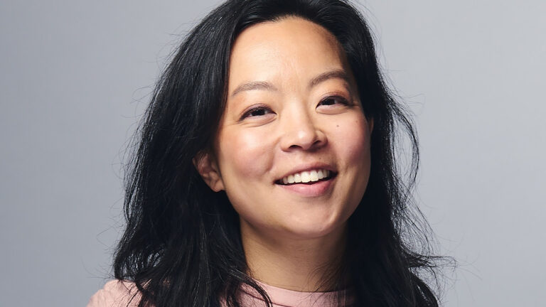 Francesca Hong smiles while posing for a portrait.