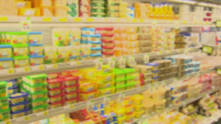 A pixelated photo illustration shows a variety of different types of butter, margarine and other dairy products on refrigerated shelves in a grocery store.
