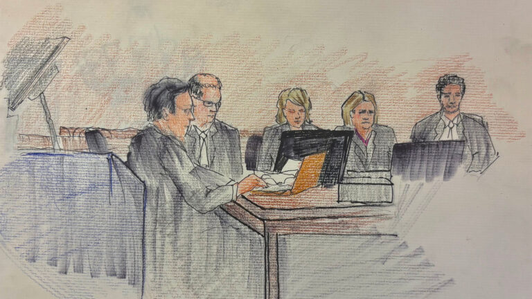 A hand-drawn and shaded sketch shows a depiction of three attorneys, Hannah Dugan and another attorney sitting at a table and facing multiple laptop computers. A hand-drawn and shaded sketch shows a depiction of three attorneys, Hannah Dugan and another attorney sitting at a table and facing multiple laptop computers.