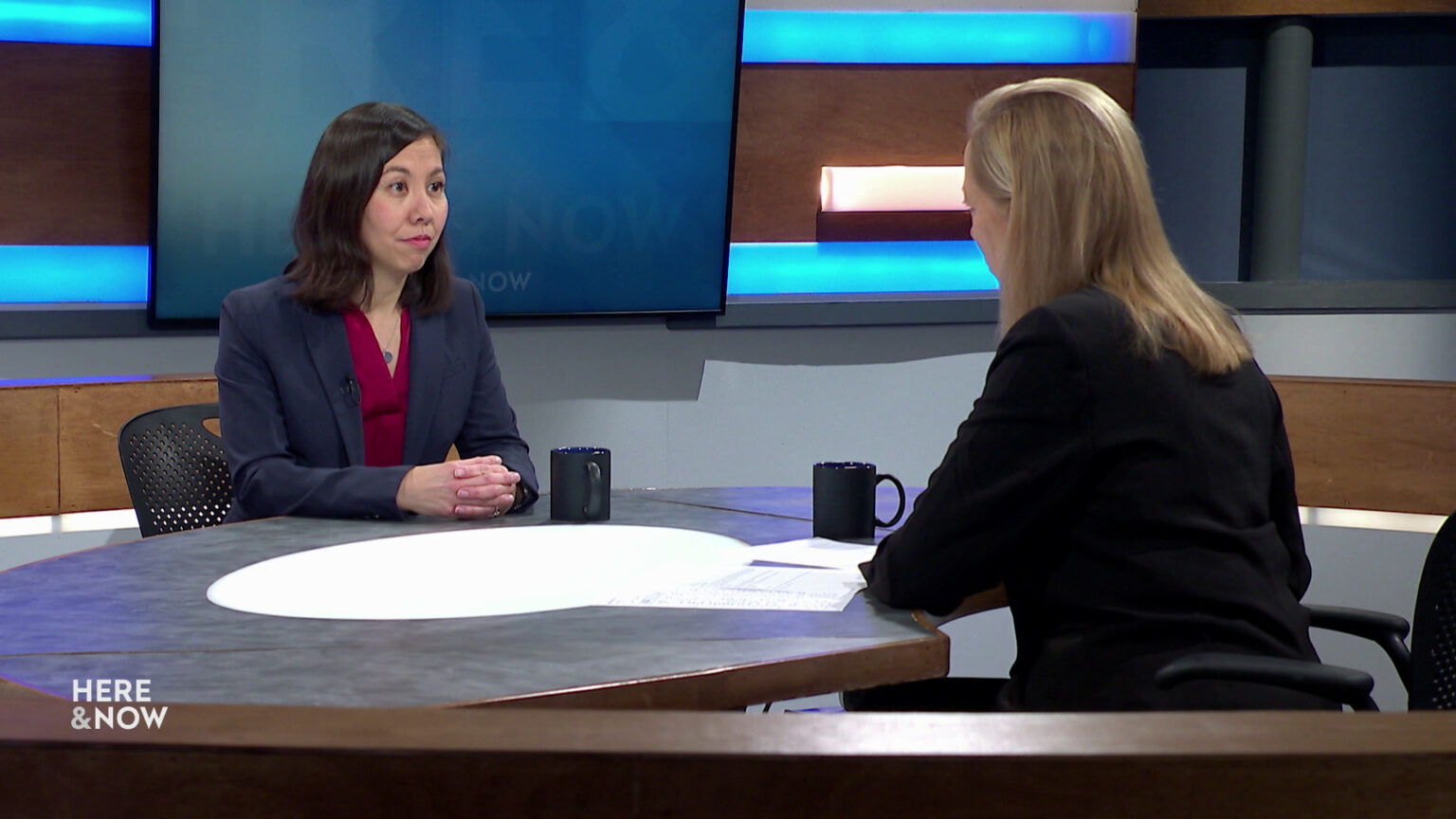 Eileen Fredericks and Frederica Freyberg sit facing each other on the Here & Now set.