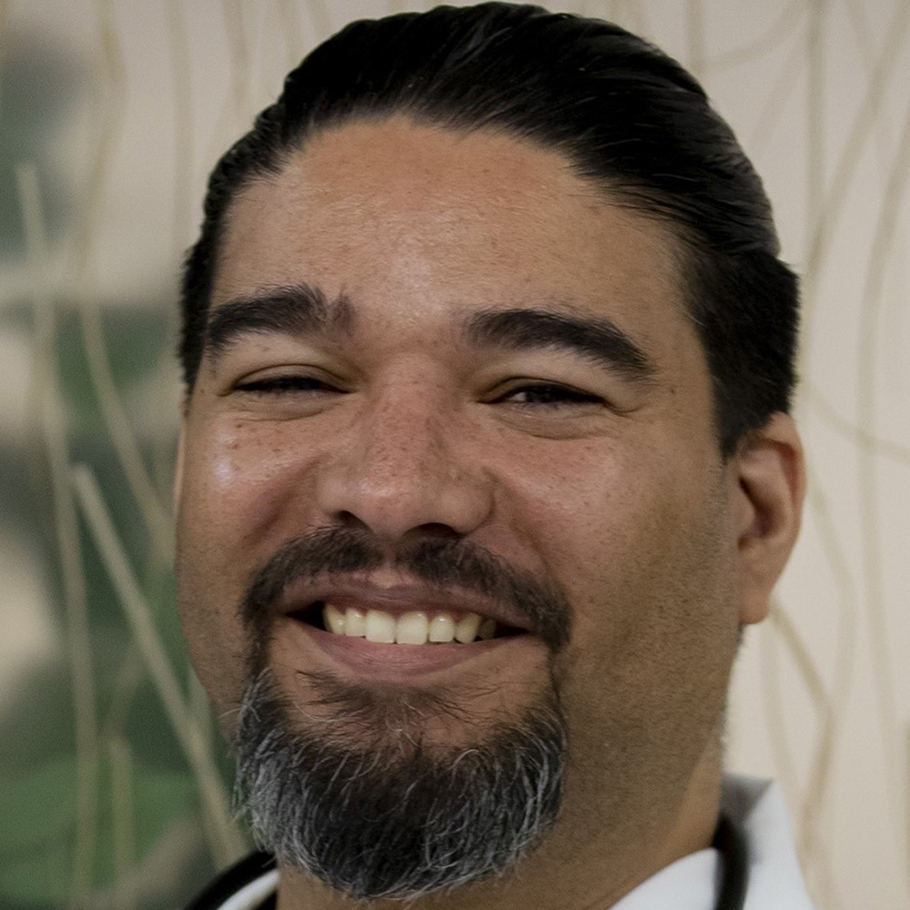 Enrique Casiano poses for a portrait.