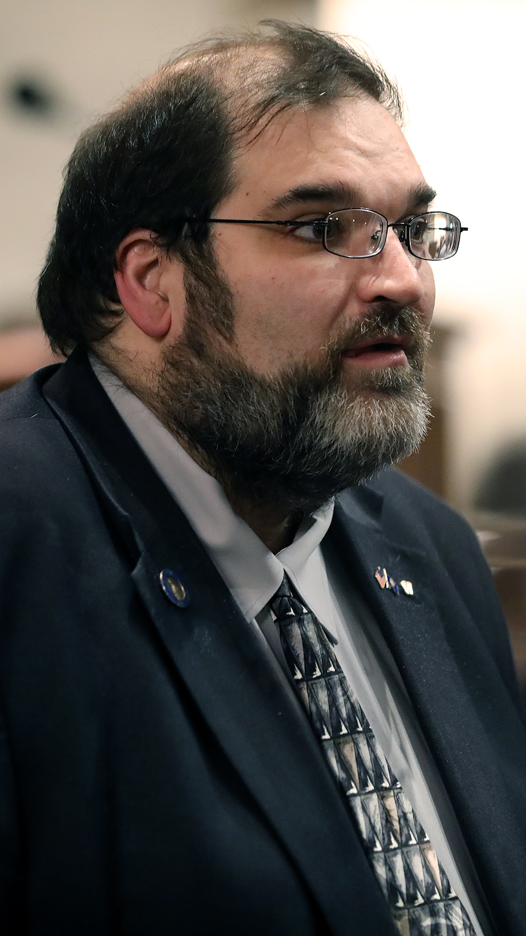 Andre Jacque stands in a room and speaks.