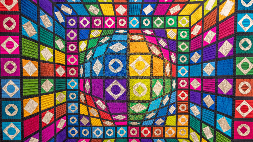 Sphere, created by Beth Nufer of Harwood, North Dakota, and quilted by Clementine Buzick, third-place winner in the 2025 Quilt Contest, Wall Quilts, Machine Quilted - Mixed or Other Type category. Original Design.