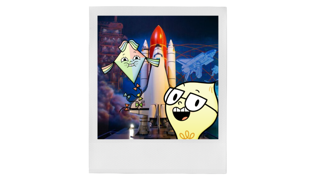 A cartoon lightbulb and kite take a photo in front of a rocket.
