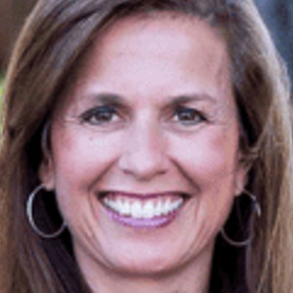 Gina Cefalu Paulick poses for a portrait.