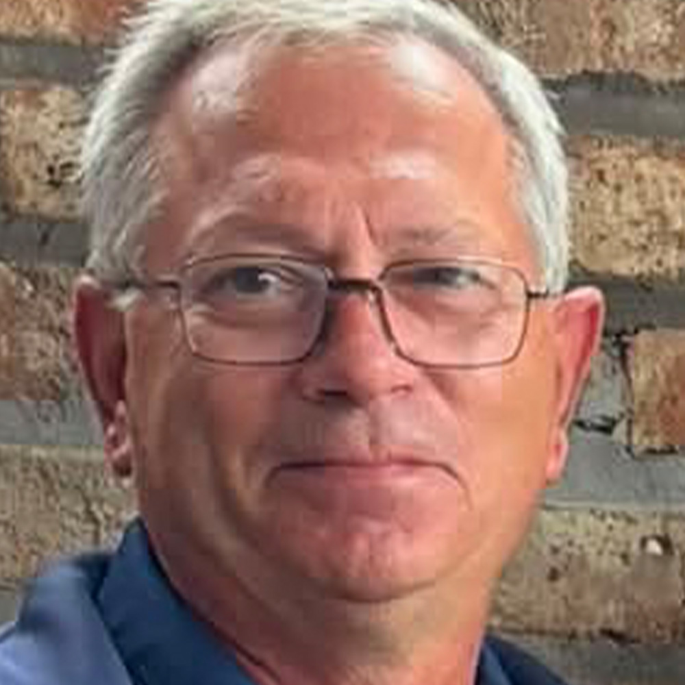 Ron Woodman poses for a portrait.