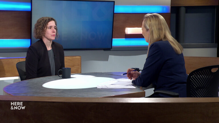 Bryna Godar and Frederica Freyberg sit facing each other on the Here & Now set.