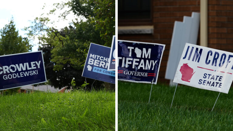 Side-by-side images show political yard signs for David Crowley and Mitchell Berman standing in one lawn with trees in the background, and Tom Tiffany and Jim Croft in another lawn with a brick wall, gutter downspout and window ledge in the background.